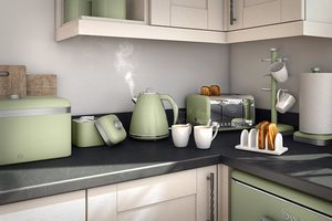 Swan Retro Toaster in a kitchen with matching items.